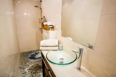 a bathroom with a sink and a toilet at Appartement très cosy avec cour in Cannes