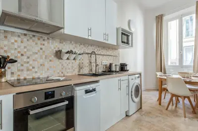 a kitchen with a sink and a dishwasher at Appartement Immaculia - Welkeys in Cannes