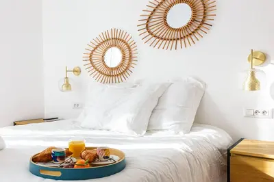 a tray of food on a bed with two mirrors at Luxury 3 Bd Aptment with Sea view in Cannes
