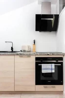 a kitchen with a stove and a counter top at Luxury 3 Bd Aptment with Sea view in Cannes