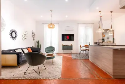 a living room with a couch and a table at Luxury 3 Bd Aptment with Sea view in Cannes