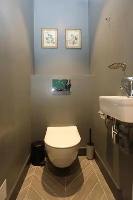 a bathroom with a white toilet and a sink at Appartement 5 min des plages Croisette in Cannes