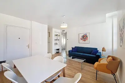 a living room with a white table and chairs at HENRI CAMILLE REAL ESTATE - Bambou- One bedroom apt downtown in Cannes
