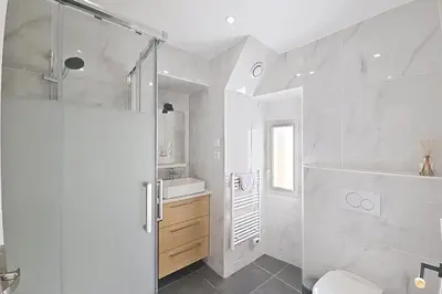 a bathroom with a shower and a toilet and a sink at HENRI CAMILLE REAL ESTATE - Bambou- One bedroom apt downtown in Cannes