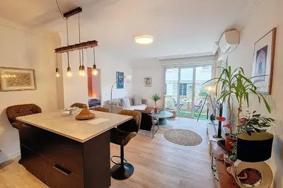 a living room with a desk and a living room at HENRI CAMILLE REAL ESTATE- Santiago - 2 bedrooms close Croisette in Cannes