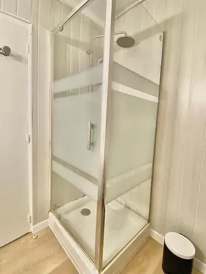 a glass shower in a bathroom with a toilet at PACA Properties 57A - Studio cosy in Cannes