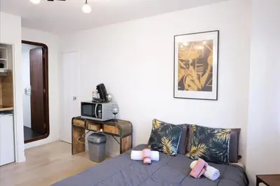a living room with a couch and a microwave at Studio centre de Cannes in Cannes
