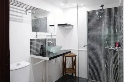 a bathroom with a sink and a glass shower at Studio centre de Cannes in Cannes