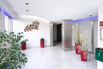 a hallway with potted plants in a building at Studio centre de Cannes in Cannes