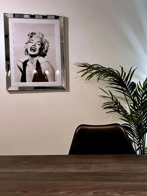 a picture of a woman is hanging on a wall at Palais 5min Luxury&Cinema Studio in Cannes