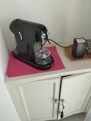 a black appliance sitting on top of a counter at WE CANNES ! Cosy 2-bedroom apartment with terrace Cannes Center in Cannes