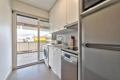 a kitchen with a sink and a dishwasher at Appartement Canto bright appartement Croisette beach in Cannes