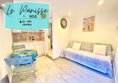 a living room with a couch and a table at Mini Studio - Le Panisse By SCLS Locations in Cannes