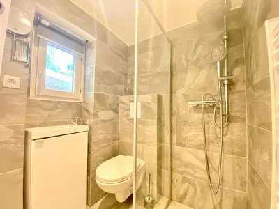 a bathroom with a toilet and a shower at Mini Studio - Le Panisse By SCLS Locations in Cannes