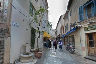 a group of people walking down a narrow street at Mini Studio - Le Panisse By SCLS Locations in Cannes