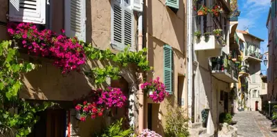 an alley with flowers on the side of a building at Mini Studio - Le Panisse By SCLS Locations in Cannes