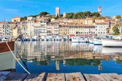 a view from a balcony of a park with palm trees at Perle Rare Cannes Croisette Vue Mer Parking 4P in Cannes