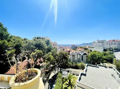 a view of a city with trees and buildings at SUPERBE 2 TERRASSES VUE MER in Cannes