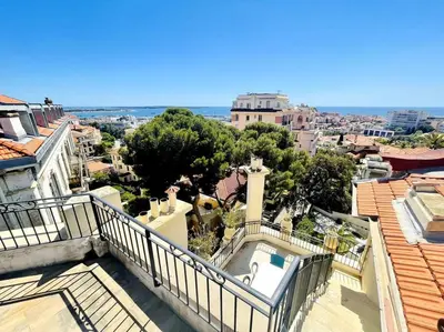a view of the city from the balcony of a house at SUPERBE 2 TERRASSES VUE MER in Cannes