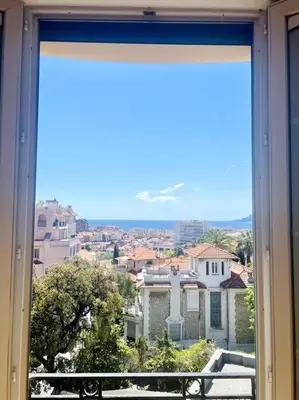 a view of a city from a window at SUPERBE 2 TERRASSES VUE MER in Cannes