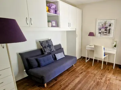 a living room with a couch and a desk at Luxury&Privacy - Pool, Parking, AC - Palais in 5' in Cannes
