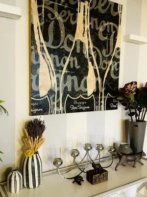 a kitchen counter with candles and a painting on the wall at Luxury&Privacy - Pool, Parking, AC - Palais in 5' in Cannes