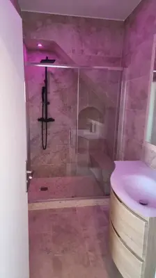 a bathroom with a shower with a toilet and a sink at Villa Paradis - Cannes in Cannes