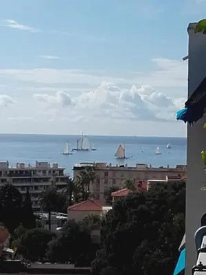 a view of the ocean from a building at Le Vallombrosa - Deux pièces lumineux et confortable in Cannes