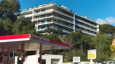 a large building is on top of a gas station at Le Vallombrosa - Deux pièces lumineux et confortable in Cannes