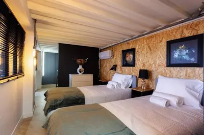 two beds in a hotel room with two beds at Le Splendide by Connexion in Cannes