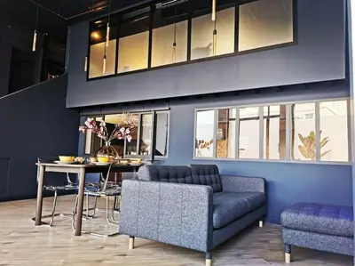 a living room with a couch and a table at Le Splendide by Connexion in Cannes