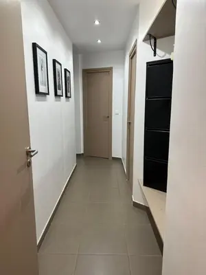 a hallway with a door and a tile floor at Charmant studio centre ville Cannes in Cannes