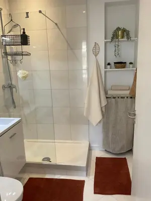 a bathroom with a shower with a glass door at Confortable studio Cannes centre in Cannes