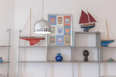 a shelf with three model boats on it at Carnot Prestige – Spacious & Central in Cannes