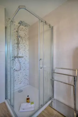 a shower with a glass door in a bathroom at IMMOGROOM - 5 min from the Croisette beaches - Terrace - Ac - Sea view in Cannes