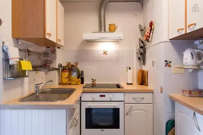 a small kitchen with a sink and a stove at Holiday or Congress, Centre - Beach in Cannes