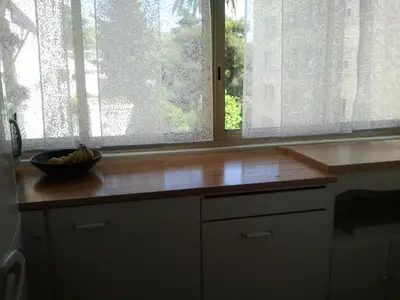 a kitchen counter with a bowl of bananas on a window at Holiday or Congress, Centre - Beach in Cannes
