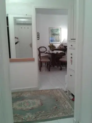 a hallway with a dining room with a table at Holiday or Congress, Centre - Beach in Cannes