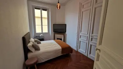 an overhead view of a street with trees and a building at Appartement Bourgeois Cannes Palais in Cannes