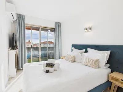 a bedroom with a large white bed with a large window at Central -300m Palais- Seaview-A/C-WIFI-spacieux in Cannes