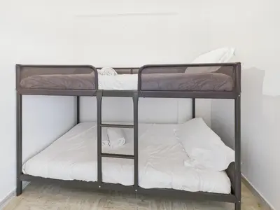 a bunk bed room with two bunk beds at Central -300m Palais- Seaview-A/C-WIFI-spacieux in Cannes
