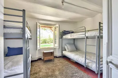 a bedroom with two bunk beds and a window at Villa vue mer Cannes in Mougins