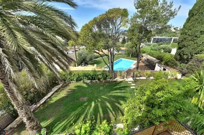 an aerial view of a garden with a swimming pool at Villa vue mer Cannes in Mougins