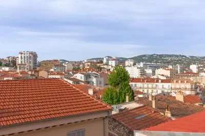 a view of a city with buildings and roofs at Un Écrin au Suquet - Studio, clim, balcon, plage, Palais des Festivals in Cannes