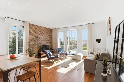 a living room with a couch and a table at Cozy 1 bedroom flat,free parking, close to center in Cannes