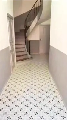 an empty hallway with stairs and a tiled floor at CANNES t4 bourgeois 790M de la plage, Palais et Croisette in Cannes