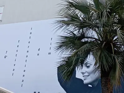 a calendar with a picture of a woman and a palm tree at cannes meynadier in Cannes
