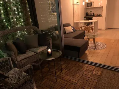 a living room with a couch and a table at Vue panoramique, plage à 100m in Cannes