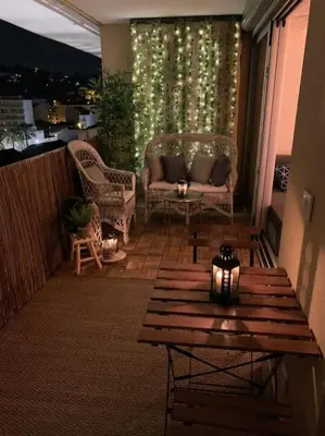 a patio with a table and chairs and a couch at Vue panoramique, plage à 100m in Cannes
