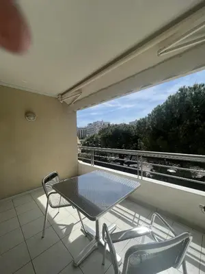 a table and chairs on a balcony with a view at Ambre d' Or apartment by Welcome to Cannes in Cannes